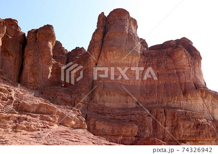 The Pillars of Solomon in the Timna Valley near Eilat in southern Israel. Geological rock formations	 74326942