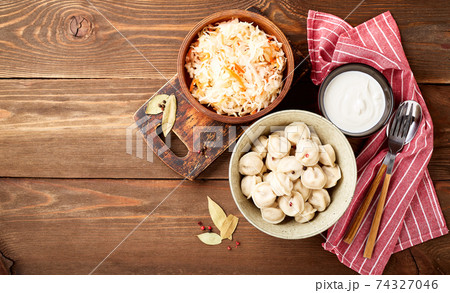 Dumplings stuffed with meat, pelmeni, ravioli, dumplings. 74327046