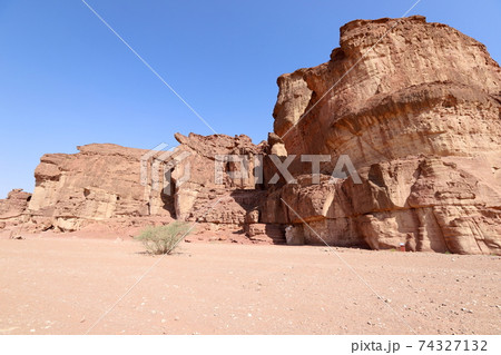 The Pillars of Solomon in the Timna Valley near Eilat in southern Israel. Geological rock formations	 74327132