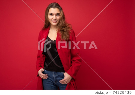 Young beautiful european stylish brunette woman wearing black blouse top and red cardigan isolated 74329439