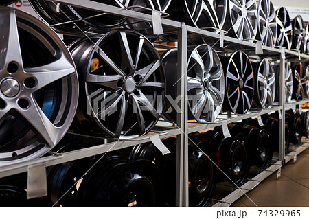 modern store with alloy wheels and tires, indoors in shop 74329965