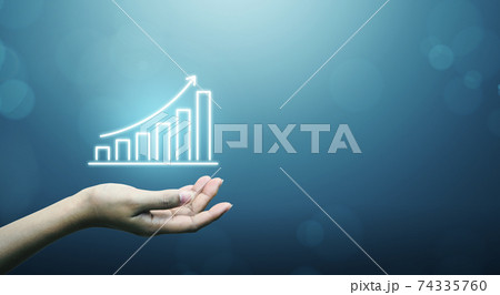 Businessman holding graph and arrow increase 74335760