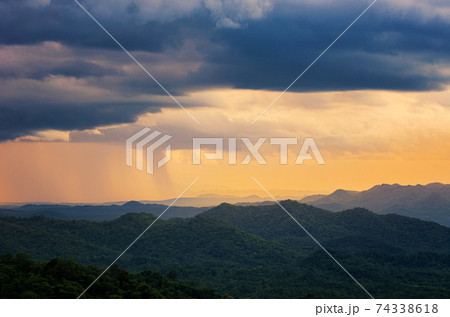 Storm over mountain. 74338618
