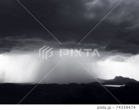 Storm over mountain. 74339474