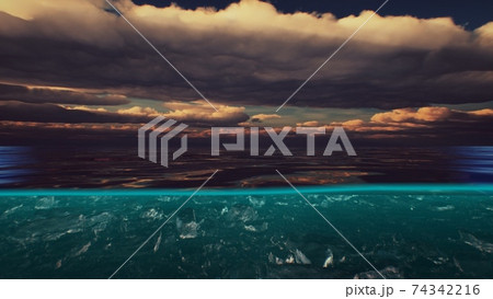 Split view over and under water in the Caribbean sea with clouds 74342216