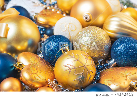 Christmas holidays composition with gold, blue balls. Christmas holidays composition with gold, blue balls. 74342415