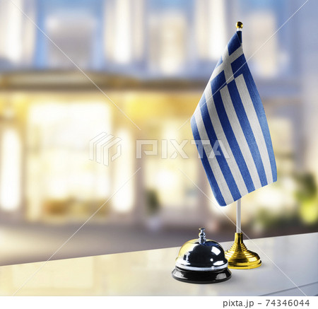 Greece flag on the reception desk in the lobby of the hotel Greece flag on the reception desk in the lobby of the hotel 74346044