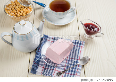 Tea party with homemade jelly made from Aquafaba and berries. Healthy dessert substitute with plant-based protein from chickpeas Tea party with homemade jelly made from Aquafaba and berries. Healthy dessert substitute with plant-based protein from chickpeas 74347895