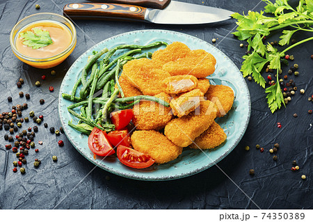 Nuggets with vegetables 74350389
