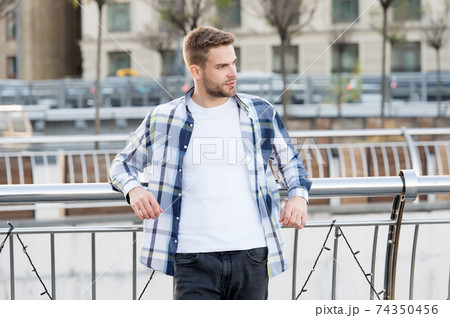 Giving man sense of style. Handsome guy lean on railing Giving man sense of style. Handsome guy lean on railing 74350456
