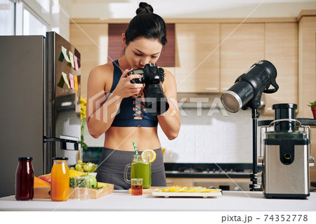 Food blogger taking photos 74352778
