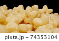 MACRO: Sweet corn stars on a black background 74353104