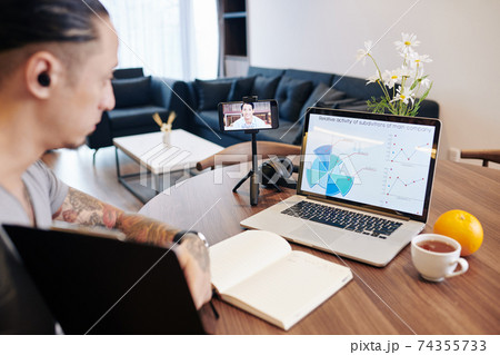 Discussing video call at video meeting Discussing video call at video meeting 74355733