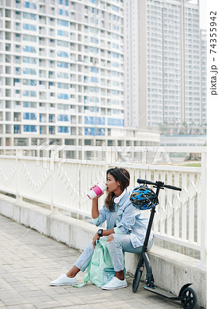 Pensive woman drinking coffee 74355942