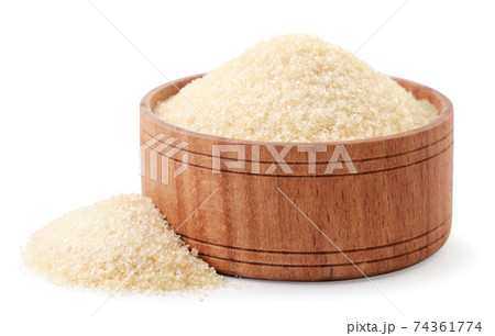 Dry gelatin granules in a wooden bowl on a white background. Isolated Dry gelatin granules in a wooden bowl on a white background. Isolated 74361774