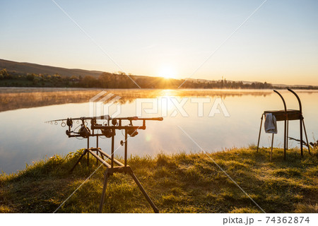 Fishing adventures. Carp fishing at sunset. 74362874