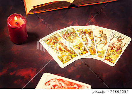 Tarot cards on a darkness background Tarot cards on a darkness background 74364554