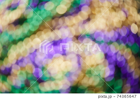 Colorful blurred background with bokhe effect for Mardi gras. Real photo. 74365647
