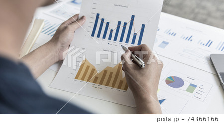 Financial businessman analyze the graph of the company's performance to create profits and growth, Market research reports and income statistics, Financial and Accounting concept. 74366166