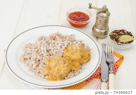 Pearl barley with meat balls. Studio Photo 74366627