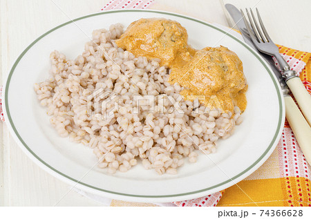 Pearl barley with meat balls. Studio Photo 74366628