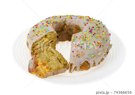 Homemade carrot cake with icing and colored sprinkles Homemade carrot cake with icing and colored sprinkles 74366656