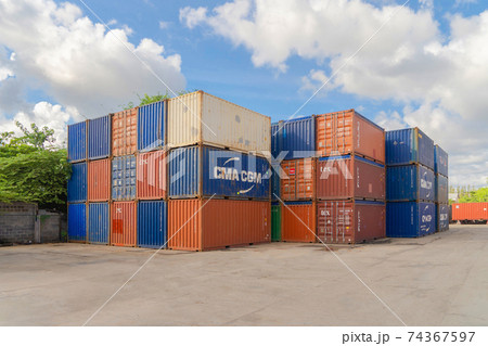 Shipping container site loading by crane in logistic port warehouse storage factory manufacturing business transportation import and export goods of freight business carrier. Shipping container site loading by crane in logistic port warehouse storage factory manufacturing business transportation import and export goods of freight business carrier. 74367597