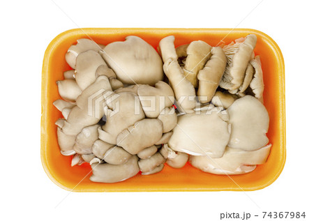 Fresh raw oyster mushrooms in package on white background 74367984