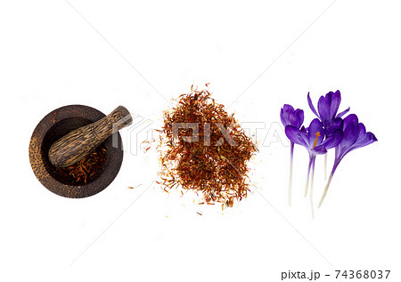Spice saffron and fresh crocus flowers isolated on white background. 74368037