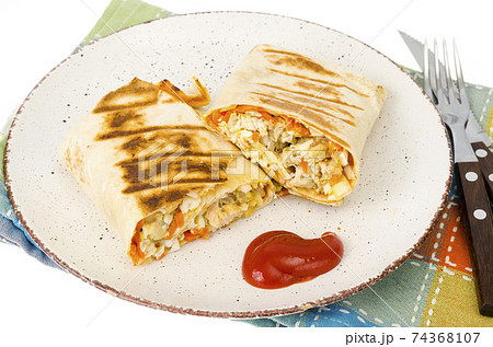 Shawarma, pita, tortilla with chicken and spicy carrots. Shawarma, pita, tortilla with chicken and spicy carrots. 74368107