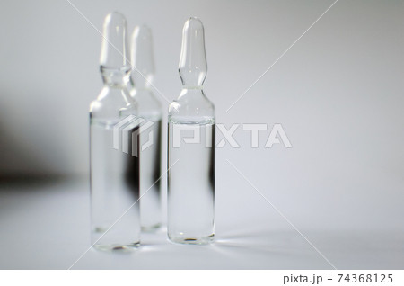 Medical ampoules for injection isolated on white background. Medicines and disease treatment, pharmacology and science concepts Medical ampoules for injection isolated on white background. Medicines and disease treatment, pharmacology and science concepts 74368125