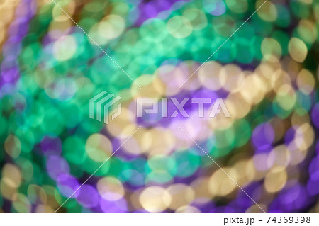 Colorful blurred background with bokhe effect for Mardi gras. Real photo. Colorful blurred background with bokhe effect for Mardi gras. Real photo. 74369398