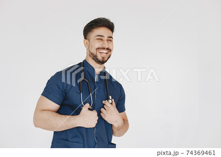 A portrait of a medical doctor posing against white background 74369461