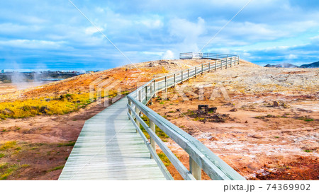 Colorful geothermal area with wooden tourist path near Keflavik, Iceland Colorful geothermal area with wooden tourist path near Keflavik, Iceland 74369902