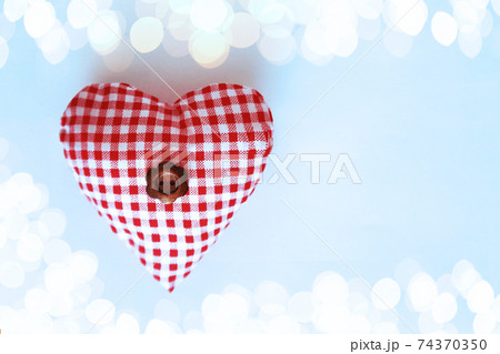Heart with a flower in the middle on a blue background Heart with a flower in the middle on a blue background 74370350
