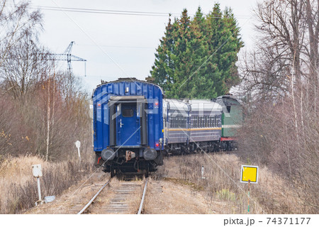 Steam train moves at autumn day time. Steam train moves at autumn day time. 74371177
