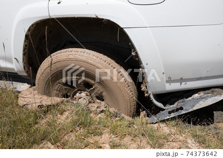 SUV got stuck in the mud, wheel closeup 74373642