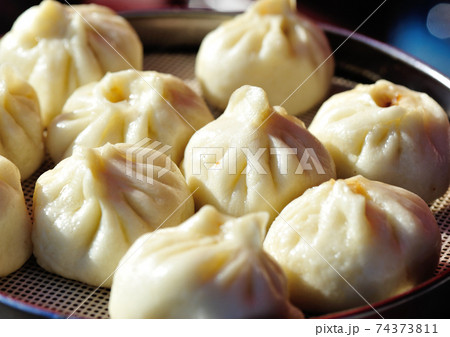 Chinese food steamed buns in a container Chinese food steamed buns in a container 74373811