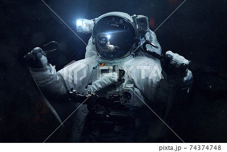 Astronaut. Science fiction space wallpaper, incredibly beautiful planets, galaxies, dark and cold beauty of endless universe. Elements of this image furnished by NASA Astronaut. Science fiction space wallpaper, incredibly beautiful planets, galaxies, dark and cold beauty of endless universe. Elements of this image furnished by NASA 74374748