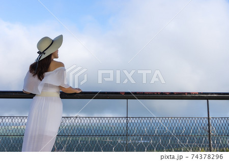 Woman at viewpoint. 74378296