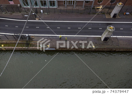Two working ports provide the mooring of a passenger ferry in Helsinki. View from the side of the ferry. Two working ports provide the mooring of a passenger ferry in Helsinki. View from the side of the ferry. 74379447