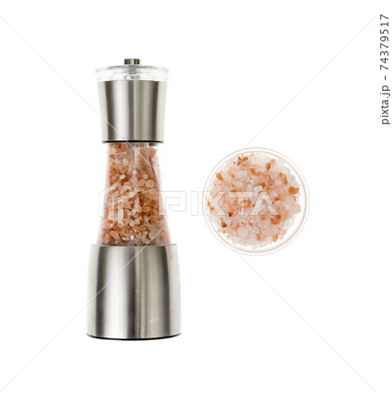 Sea salt in salt shaker, mill on white background. Sea salt in salt shaker, mill on white background. 74379517