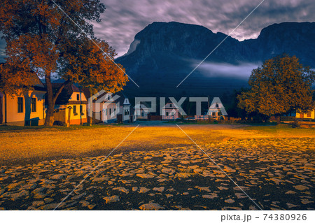 Early morning scenery in Rimetea with Piatra Secuiului mountain, Romania Early morning scenery in Rimetea with Piatra Secuiului mountain, Romania 74380926