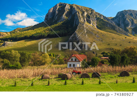 Farmland and old tractor in Rimetea village, Transylvania, Romania 74380927