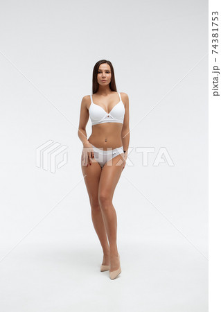 Slim woman in lingerie in studio 74381753