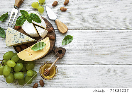 Different types of cheese with snacks Different types of cheese with snacks 74382237