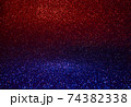 Red and blue glitter and sparkling glitter. Colour transition through the middle 74382338