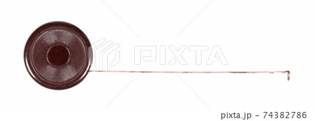 Old scratched brown metal tape measure 74382786