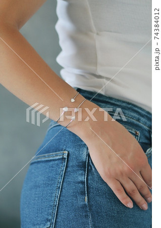 Tender jewerly on female hand, close up shot Tender jewerly on female hand, close up shot 74384012