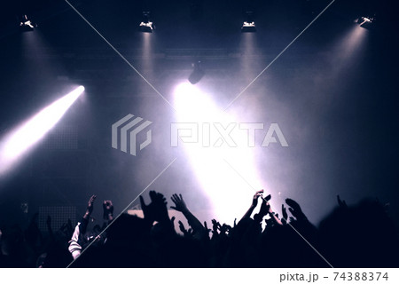 Partying concert crowd and stage lights Partying concert crowd and stage lights 74388374